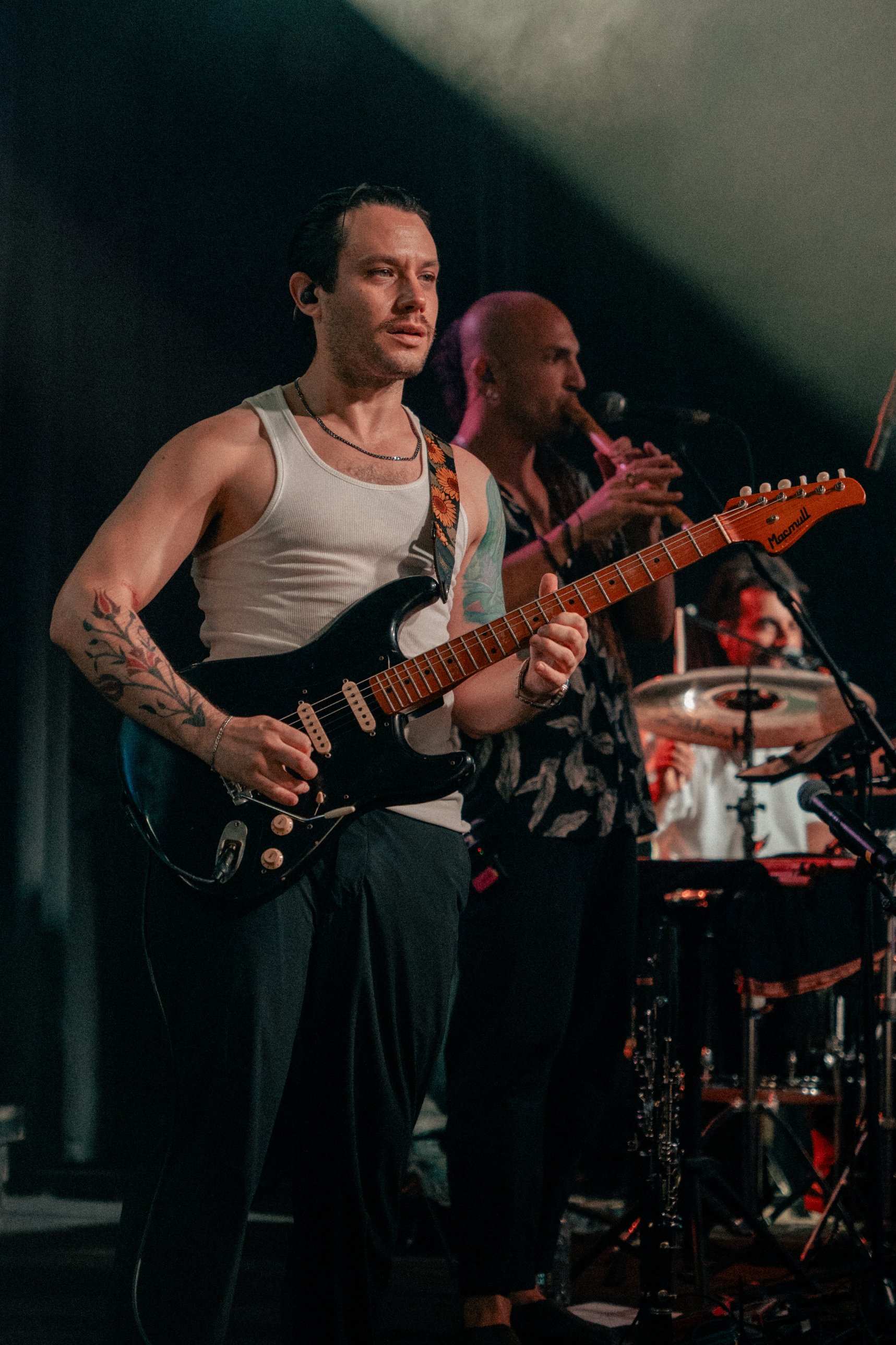 YUZ on guitar with the flute player behind him